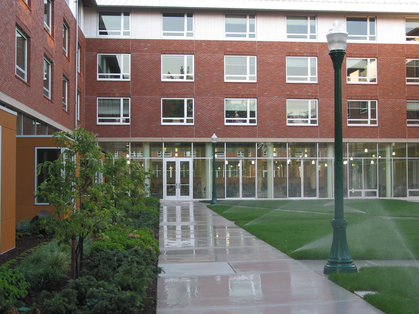 a building with a green lawn