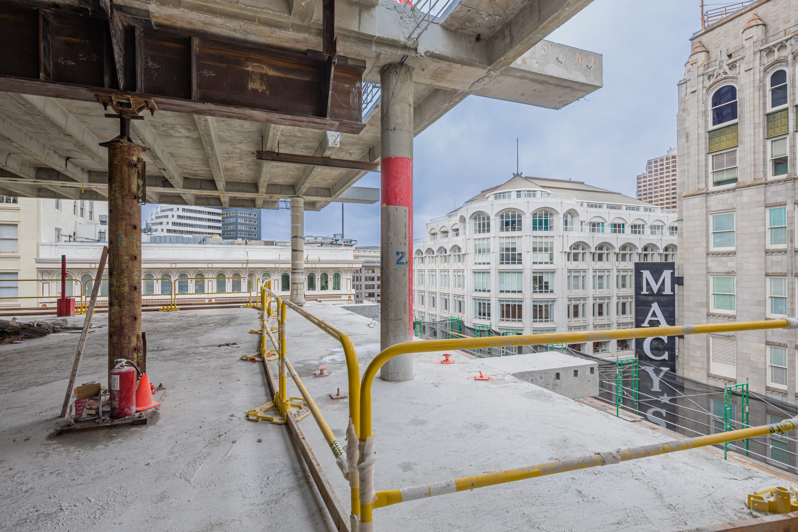 a train station with yellow rails