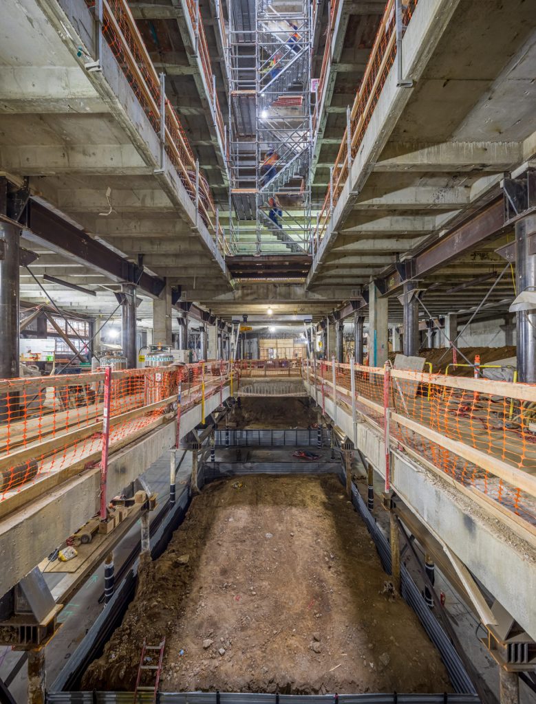 a large warehouse with many rows of shelves