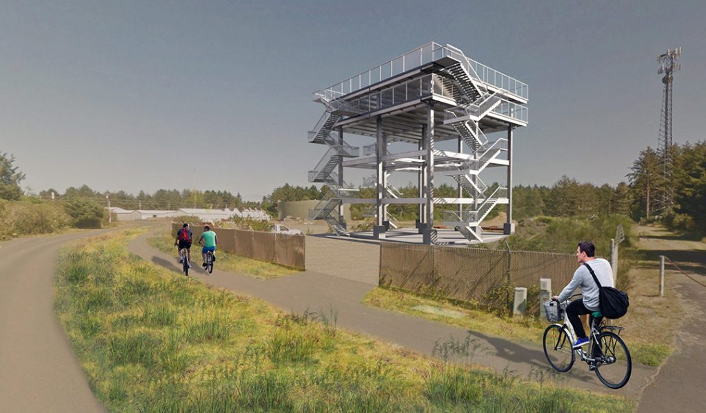 a person riding a bicycle on a road with an observation tower with many stairs