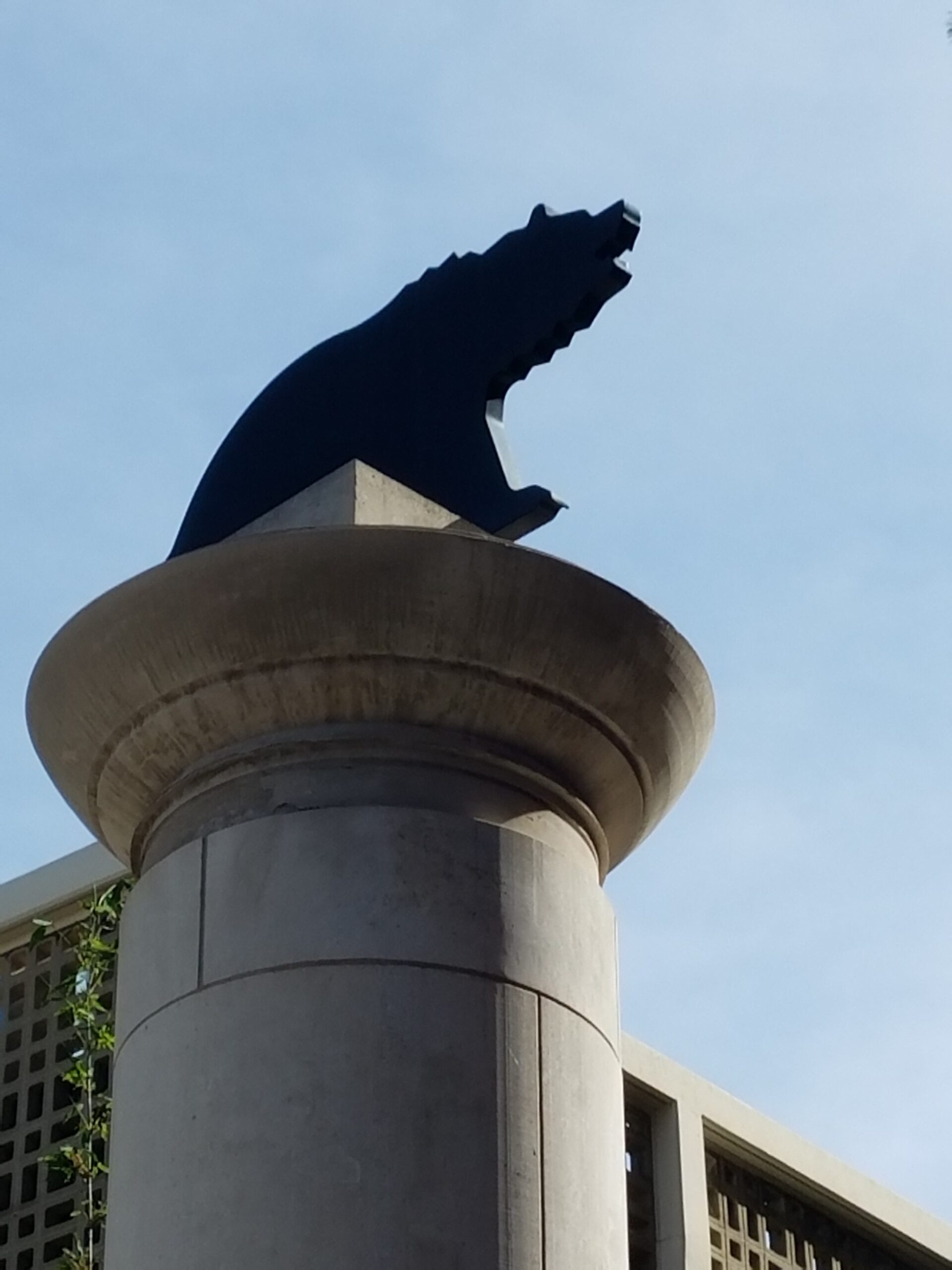 a statue of a bear on top of a pillar