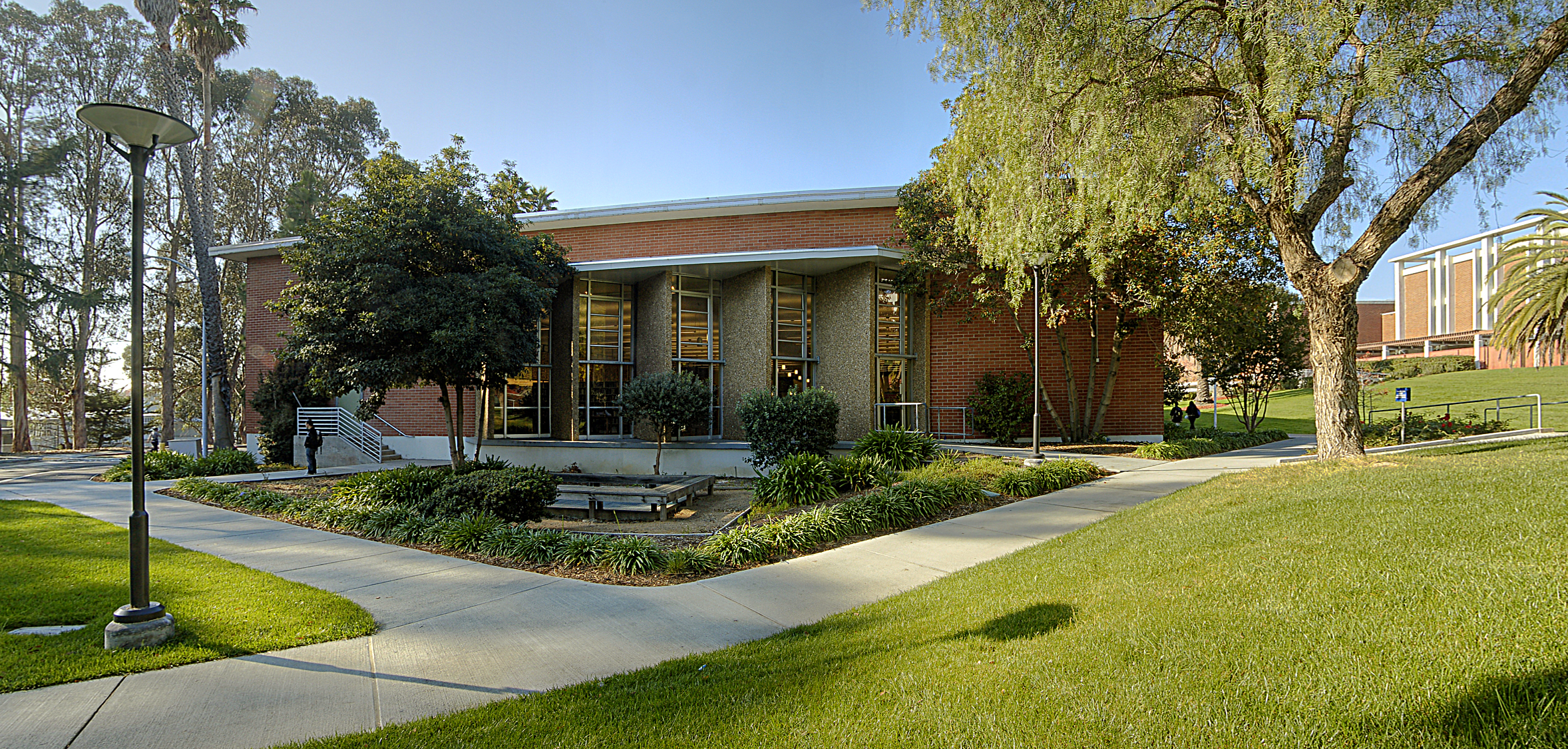 a building with trees and grass