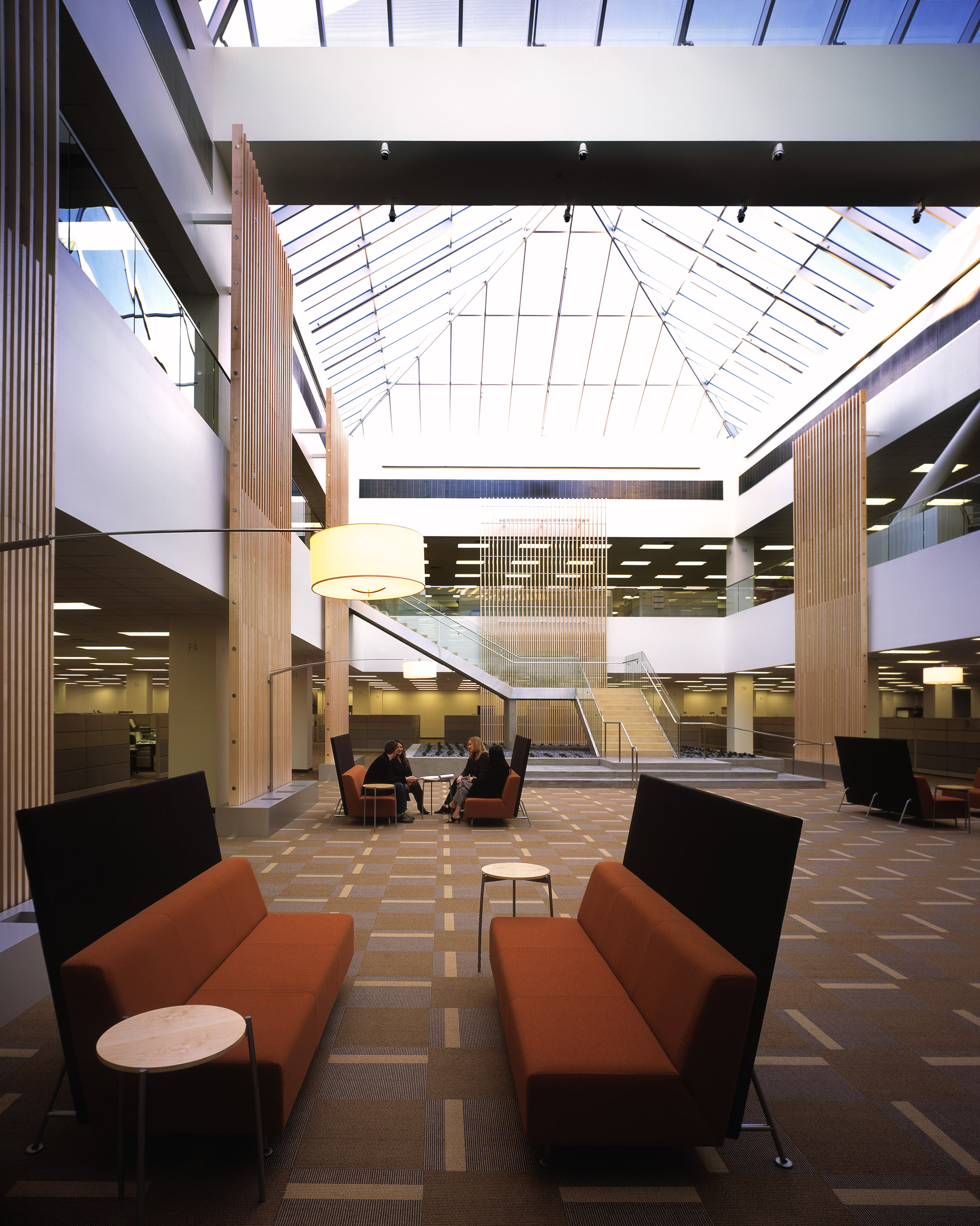 a room with chairs and a large white awning