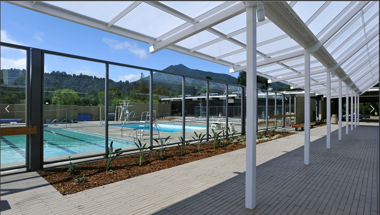 a swimming pool with glass walls