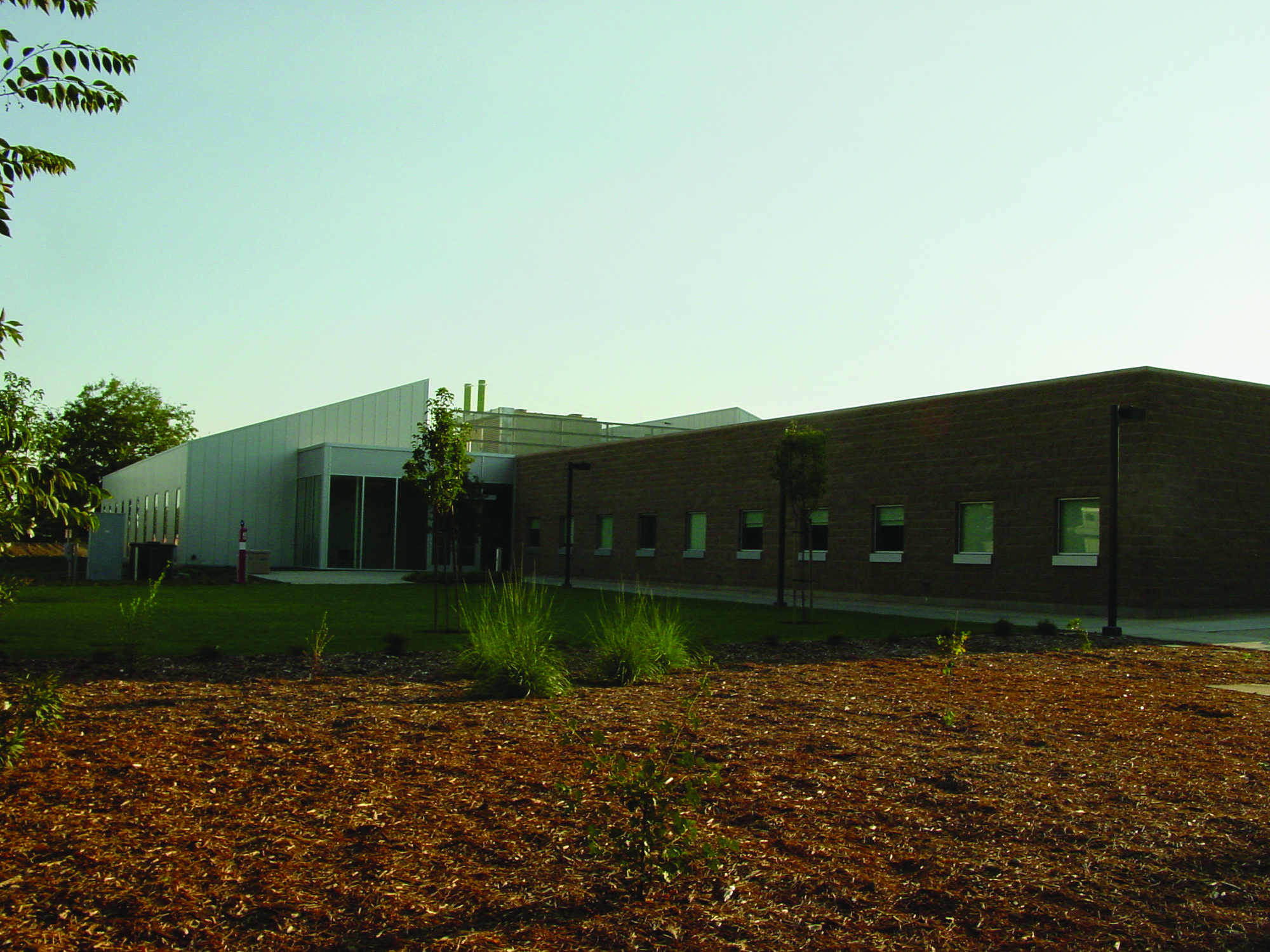 a building with green lawn in front