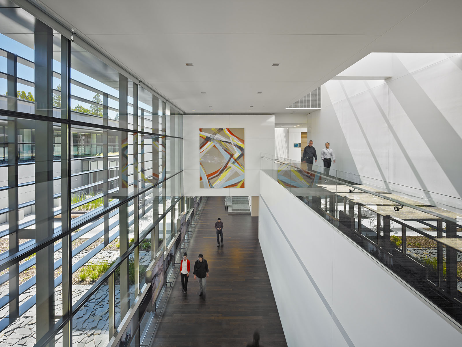 a group of people walking through a building