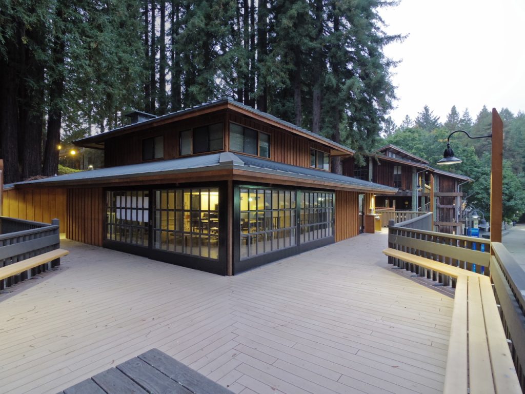 a house with a deck and trees