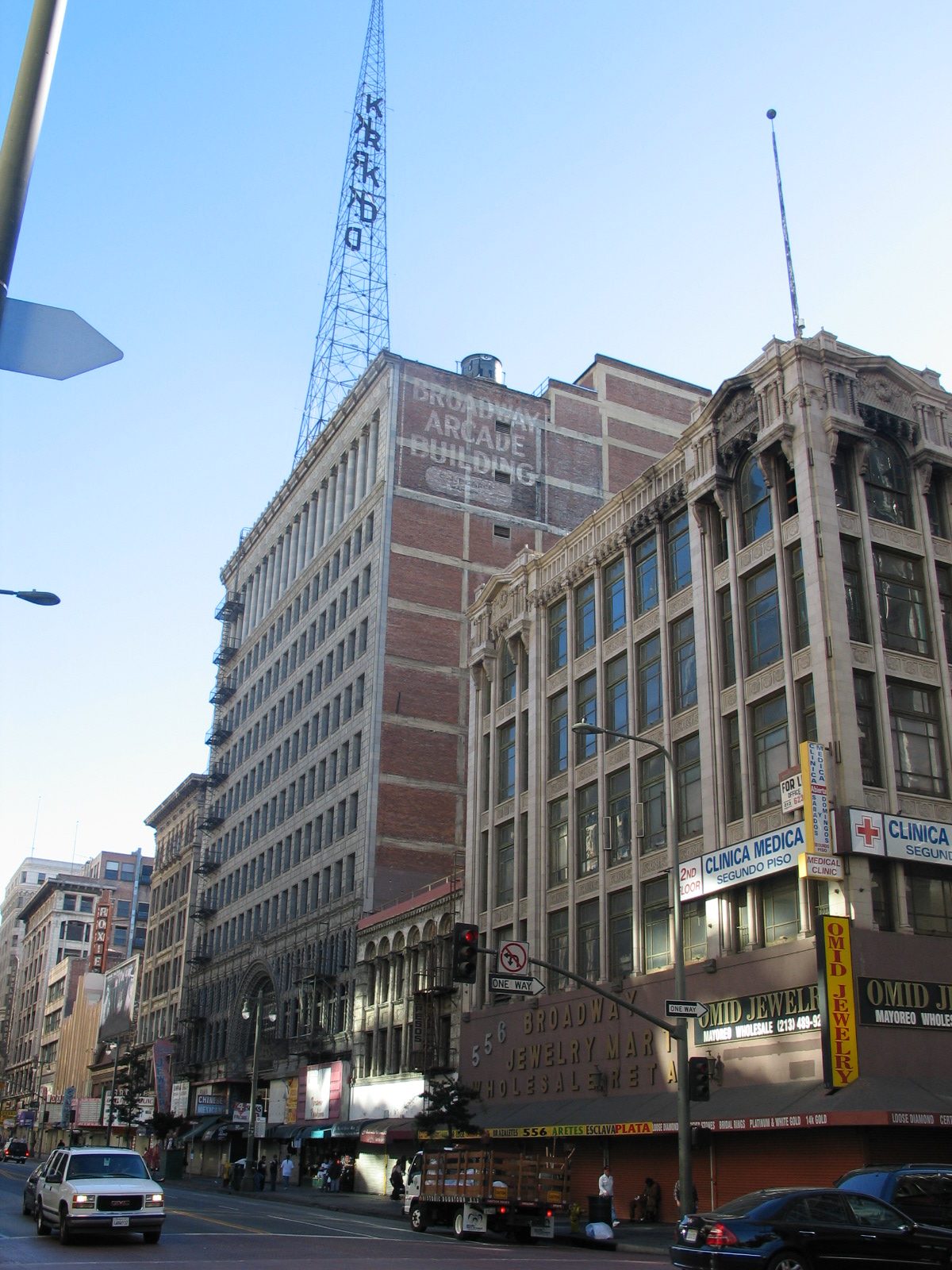 a tall building with a crane in the background