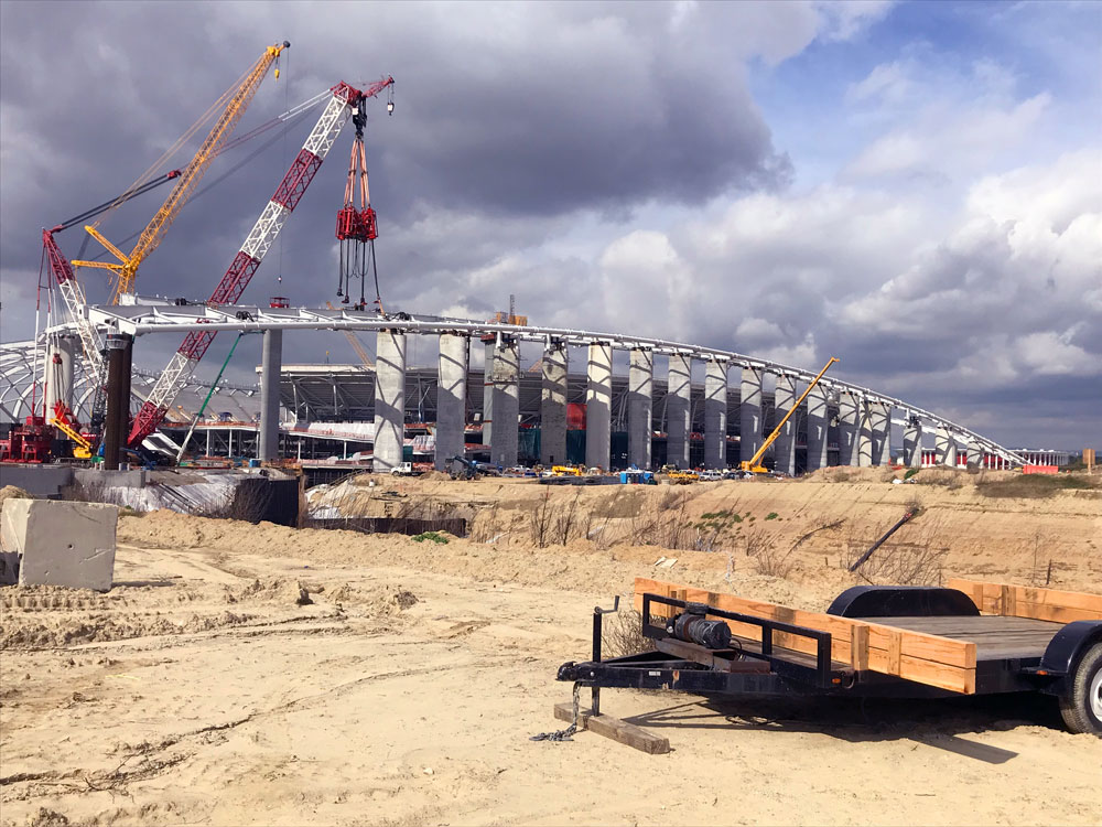 a construction site with cranes