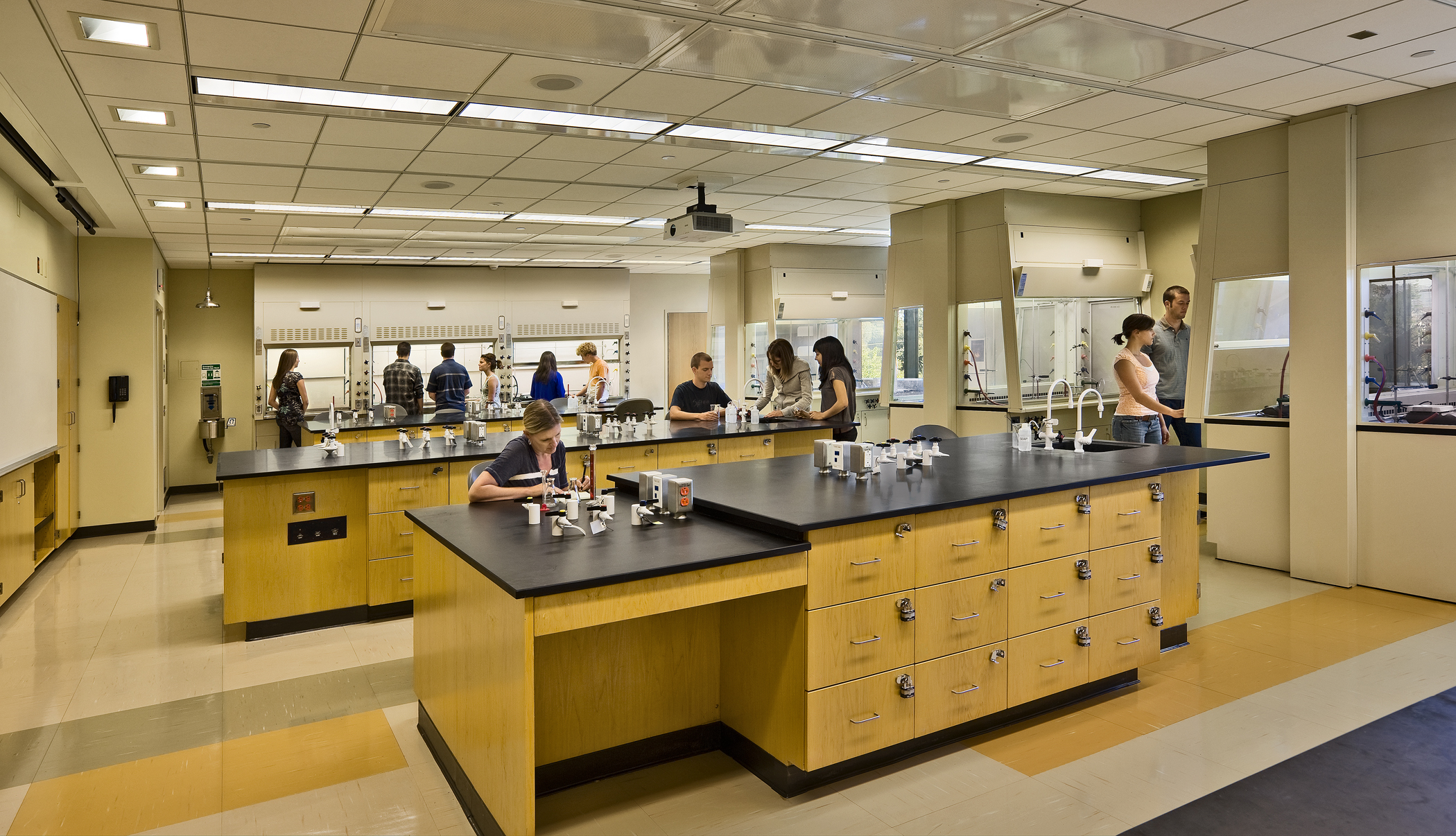 a large kitchen with people