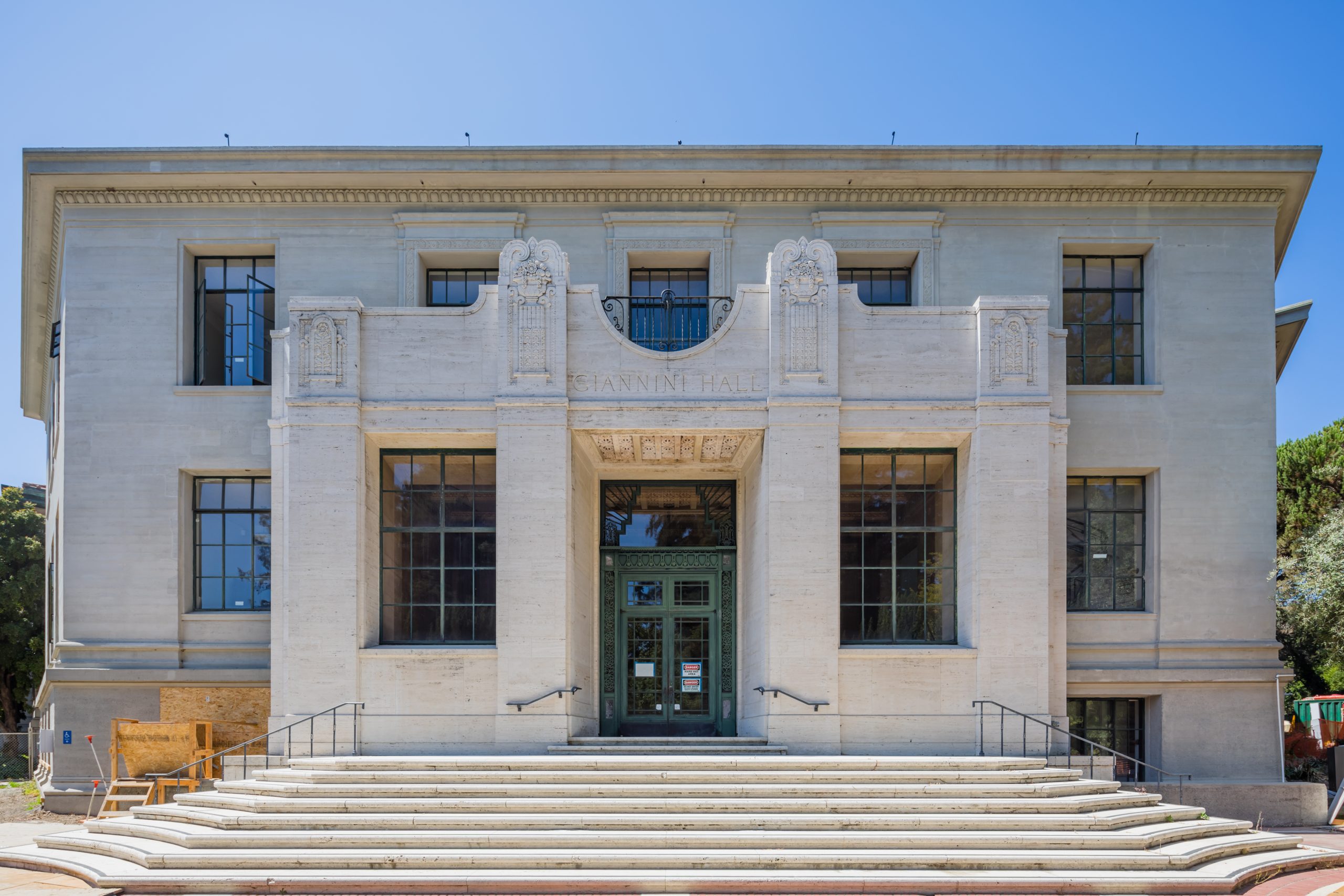 a large white building with a staircase