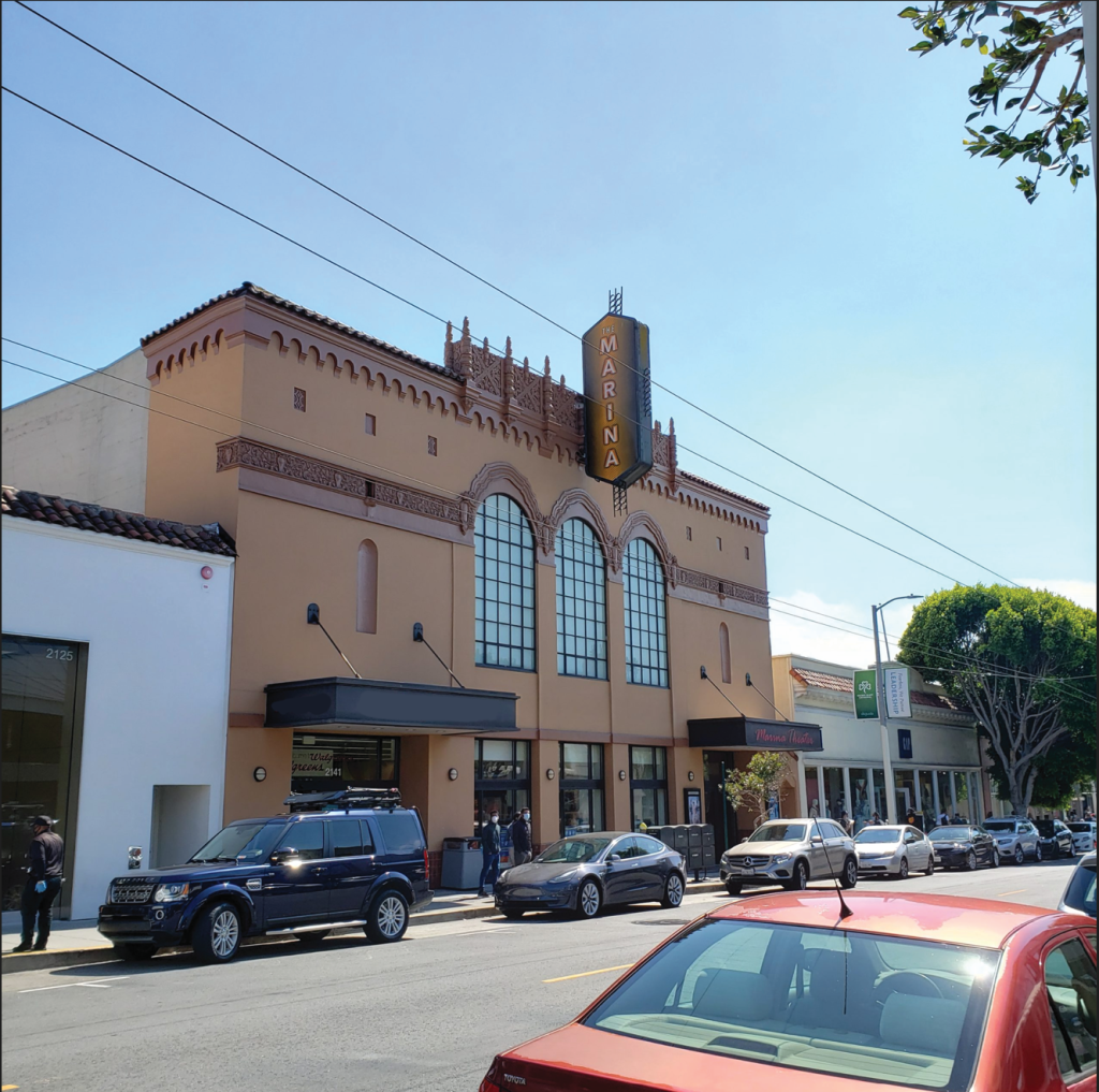 a street with cars and buildings