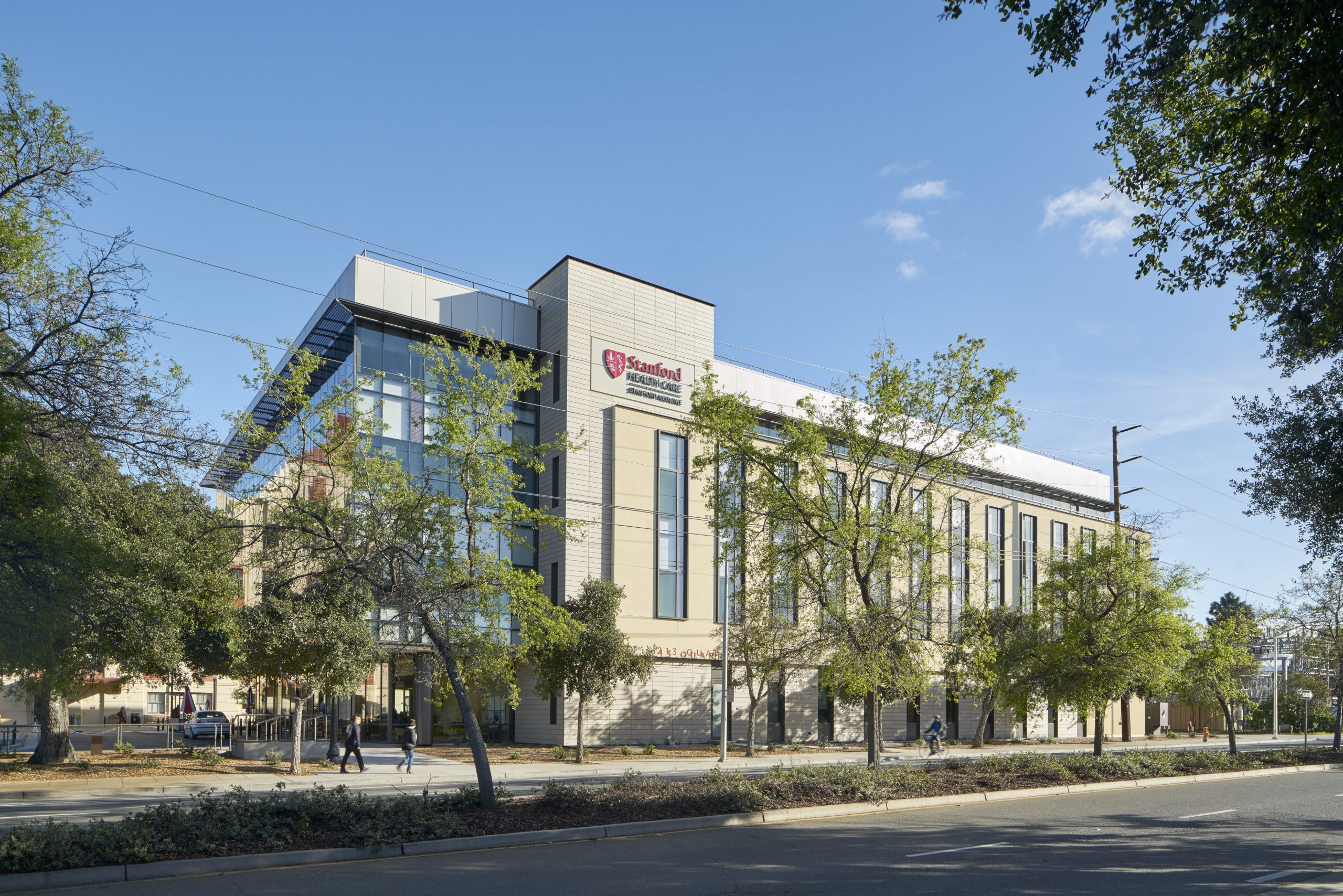 a building with trees and grass