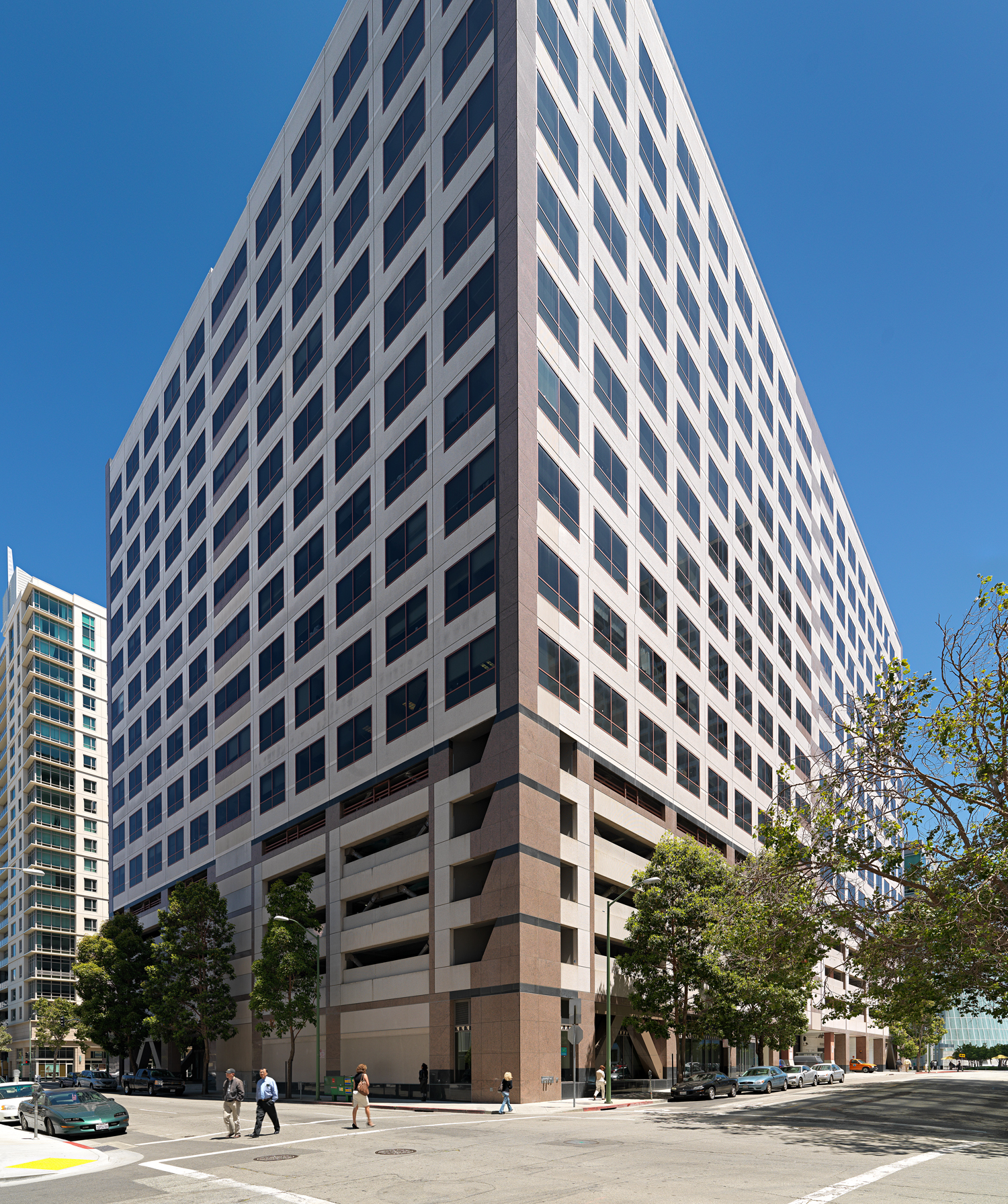 a tall building with people walking around