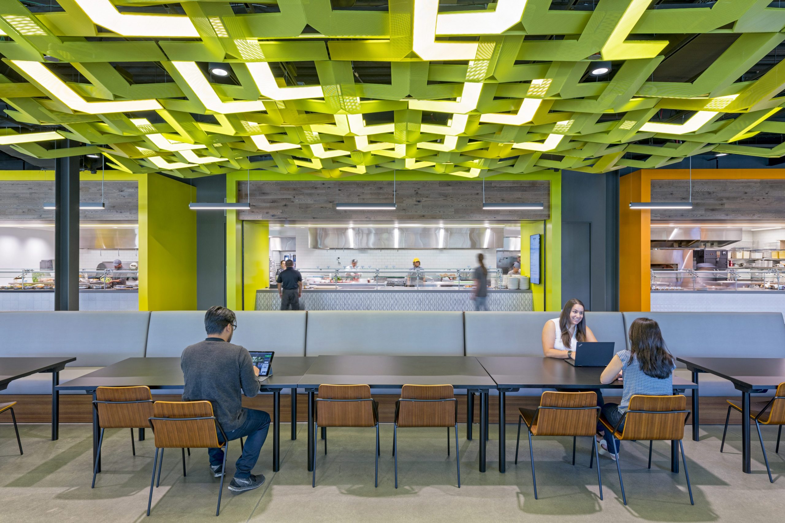 people sitting at tables in a room