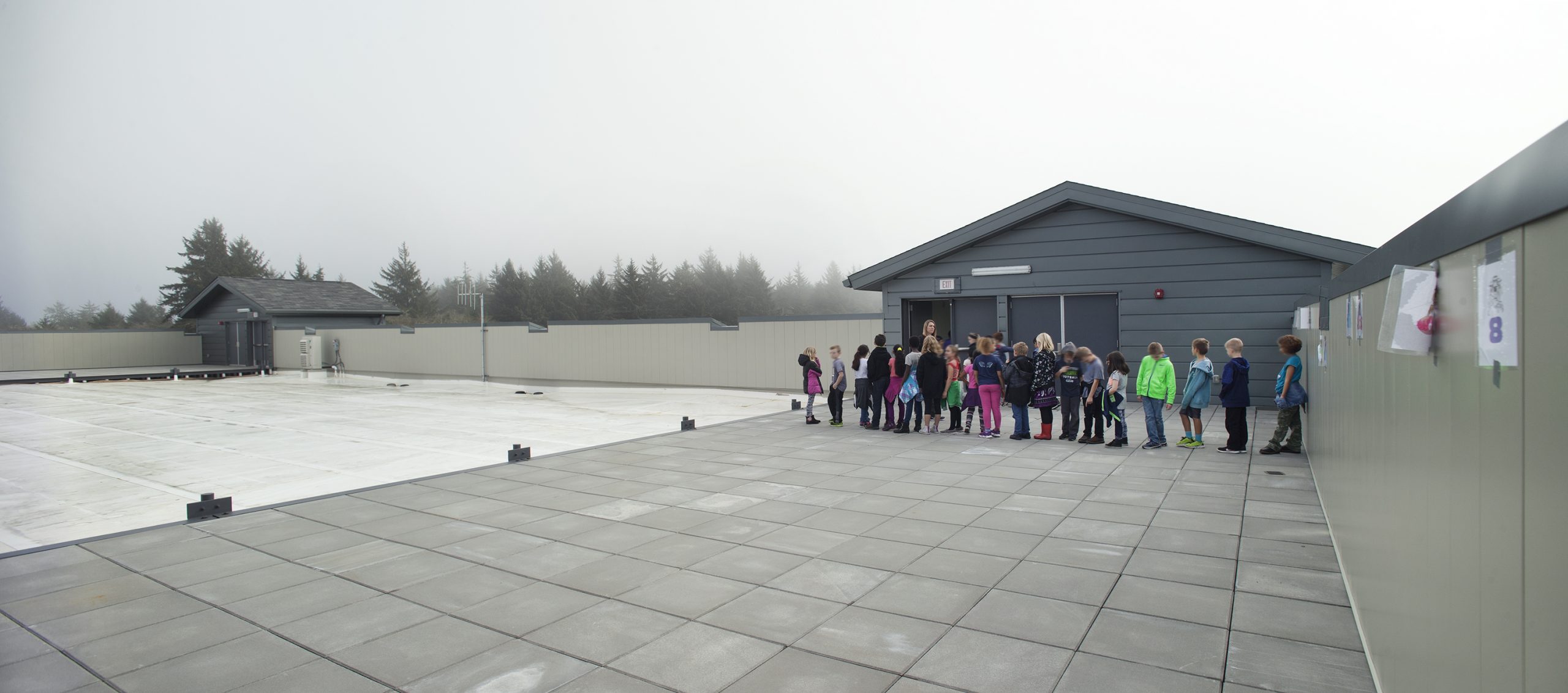 a group of people standing outside a building