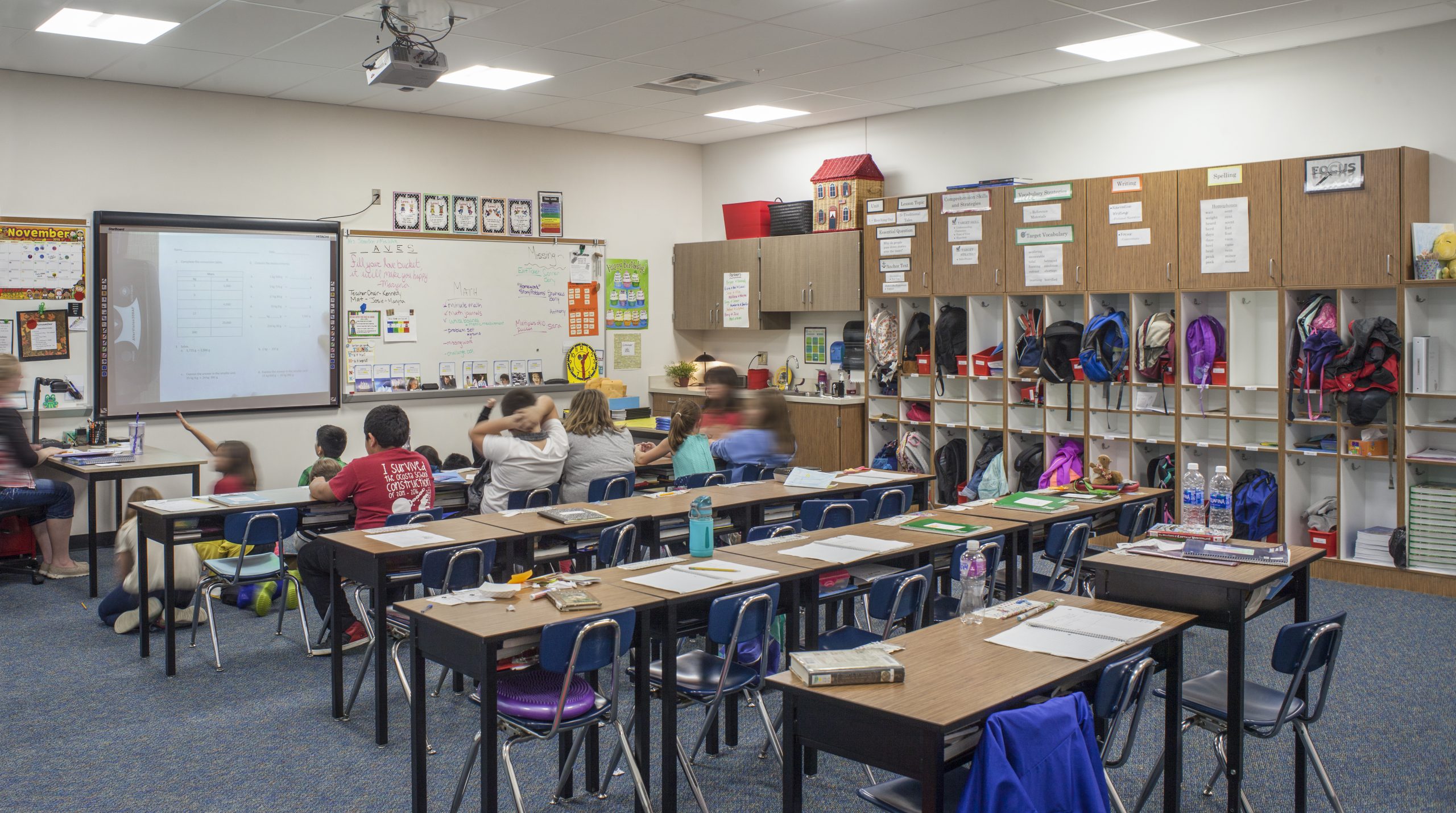 a classroom with desks and chairs