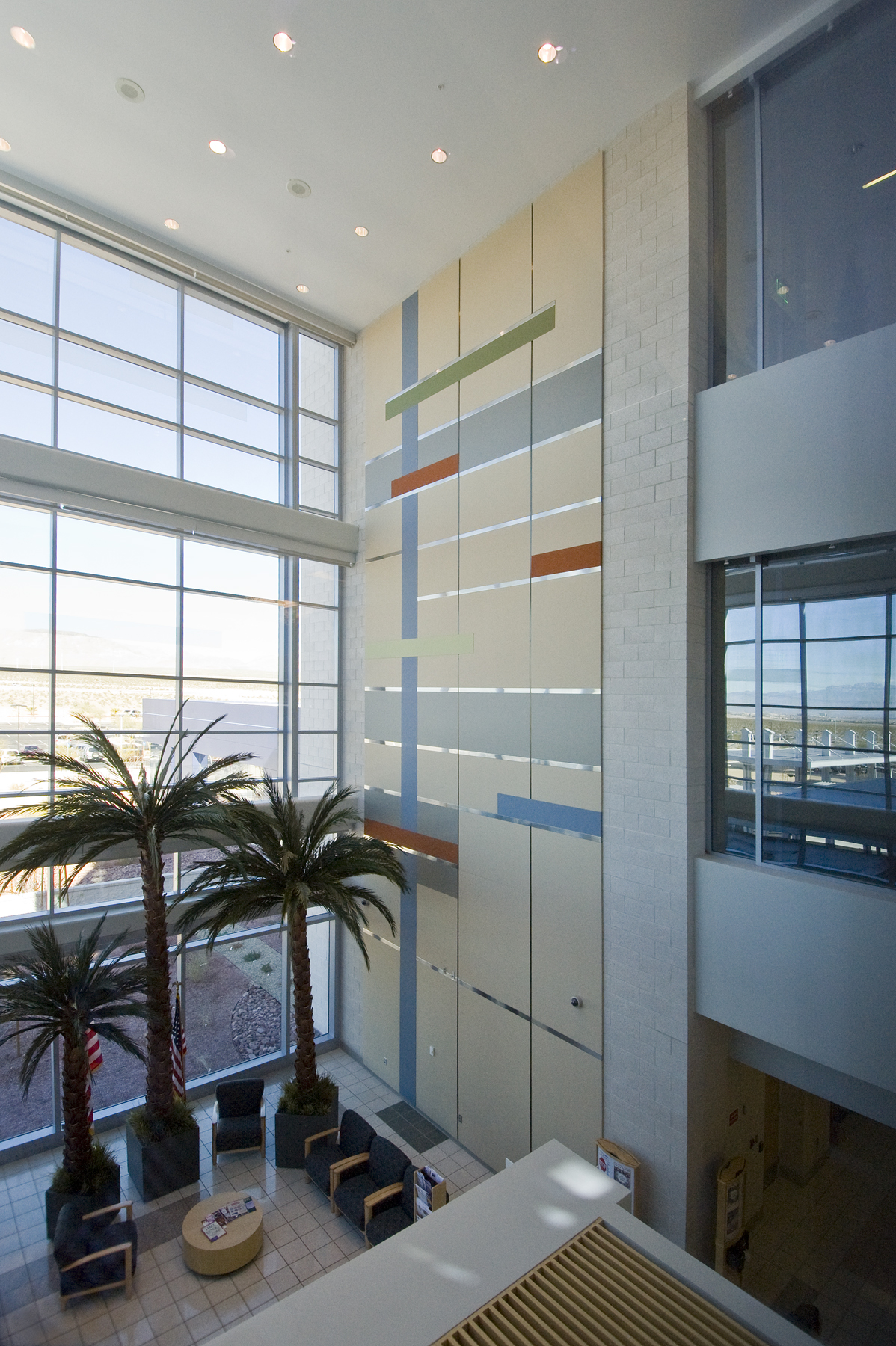 a room with a glass wall and plants